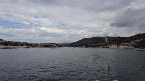 Observing-the-scenery-from-a-passing-boat-amidst-the-waters-surrounding-the-Elafiti-Islands,-Croatia,-embodies-the-concept-of-coastal-exploration-and-maritime-adventure