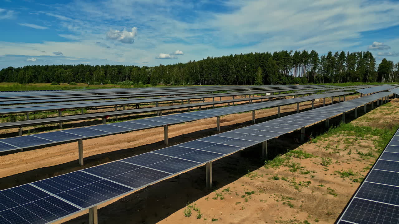 Aerial View Of Solar Panels Power Plant On A Sunny Rural Landscape
