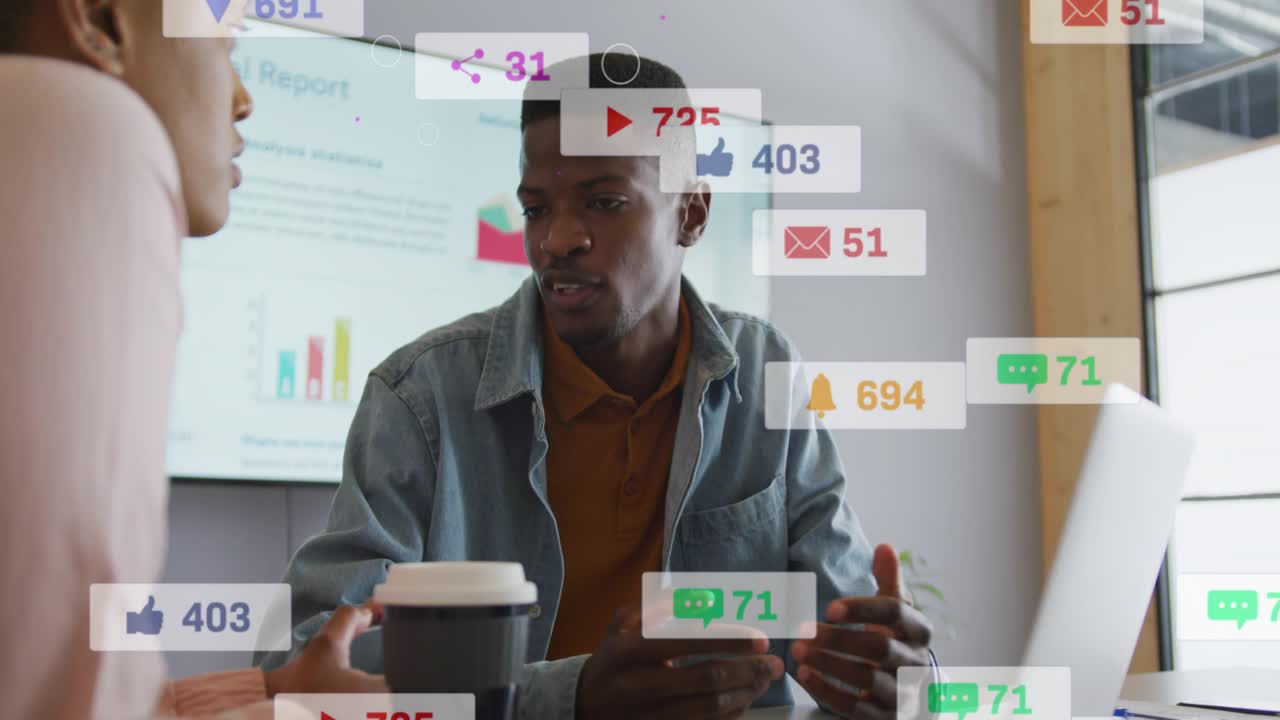 Woman tapping phone, man pointing at laptop, alerts rising over screen, showing marketing metrics