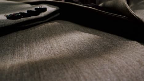 closeup of an expertly tailored suit that beautifully showcases its sophisticated buttons and fine fabric texture