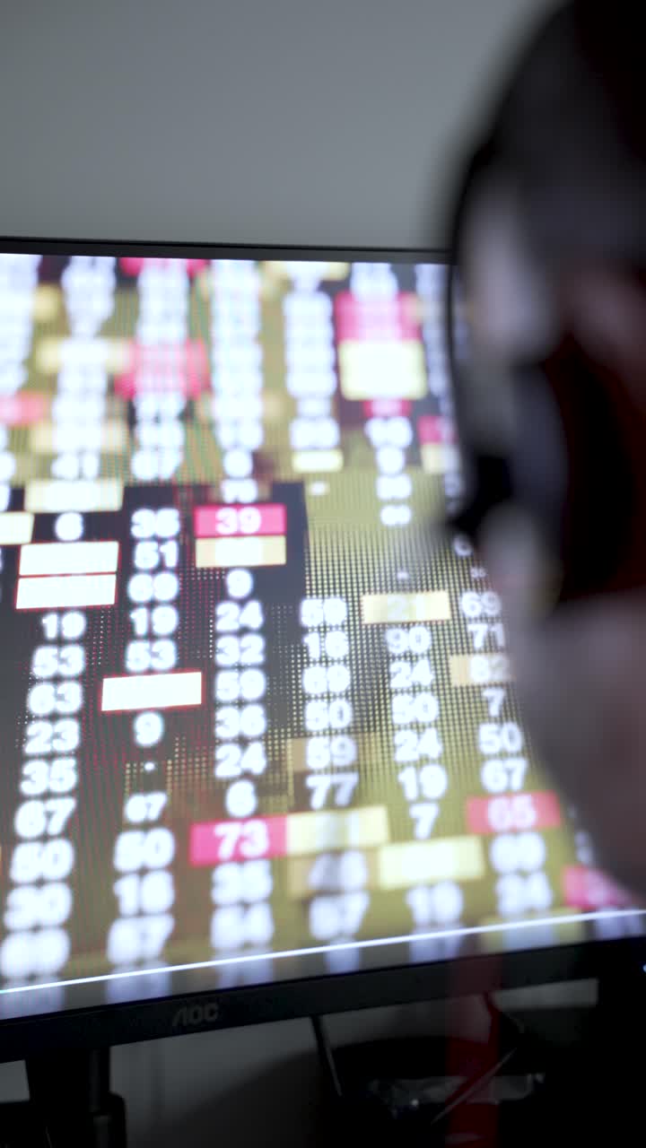 Stock market chart displayed on screen with dynamic numbers and colors