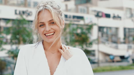 smiling woman in white coat