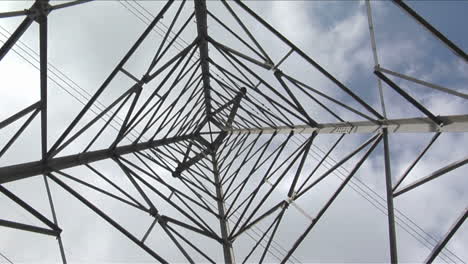 Wires stretch to either side of a utility tower