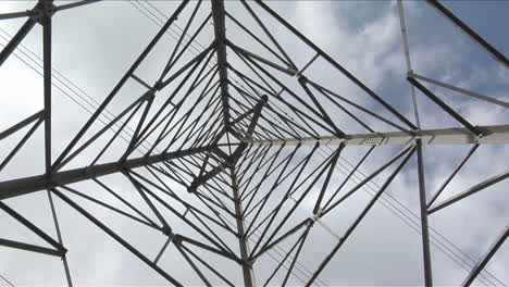 wires stretch to either side of a utility tower