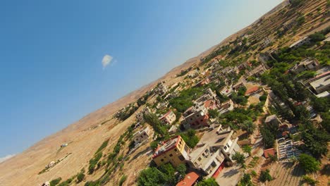 drone fly over historic town with rocky mountains in lebanon