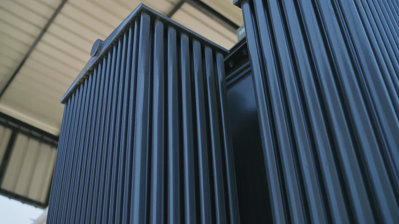 Low angle shot of powerful transformer of an industry