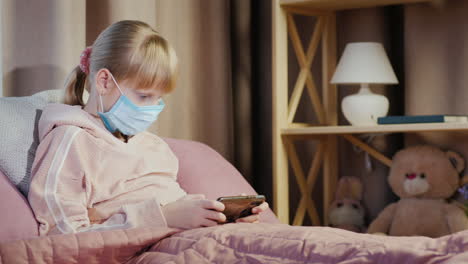 Devuka-In-A-Gauze-Bandage-Plays-On-A-Smartphone-Quarantine-And-Root-Ingesthes-At-Home-Concept