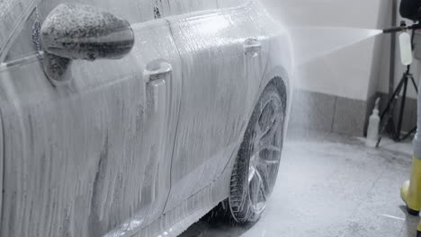 car foam washing in a detailing station