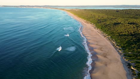 drone aerial pacific ocean waves sea shot with sandy beach bushland central coast norah head north entrance landscape nature travel tourism central coast australia 4k