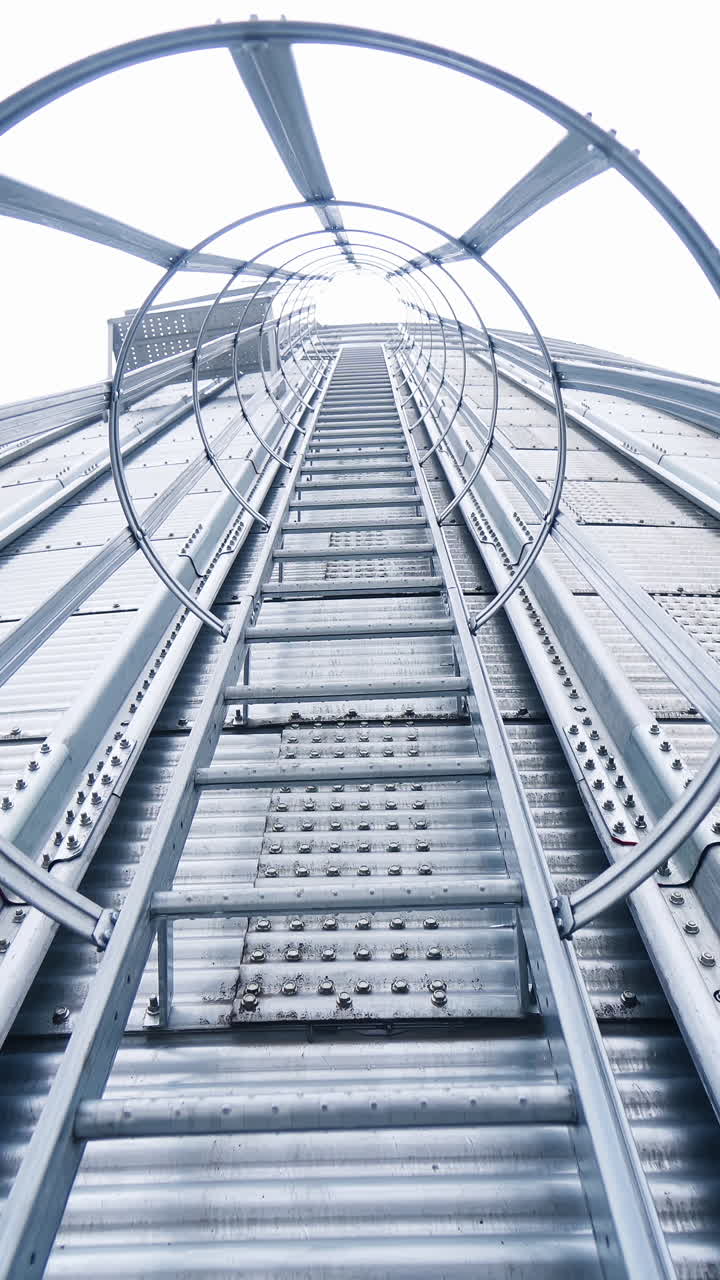 Steel hude agricultural storage for farming. Big storage elevator construction. Vertical video