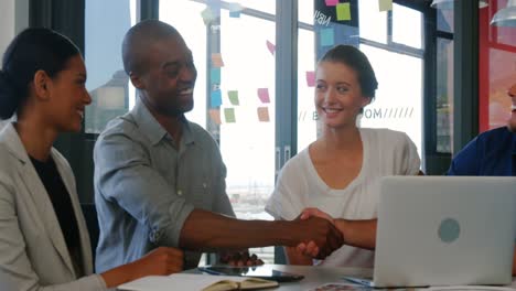 business executives shaking hands with each other