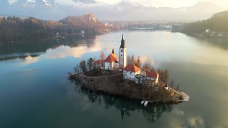 stunning 4k aerial drone video captures lake bled, slovenia, at sunrise