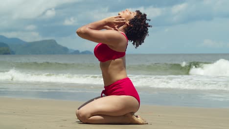 Embrace-the-sunshine-as-you-see-a-girl-in-her-youth-elegantly-dressed-in-a-bikini-on-a-white-sand-beach