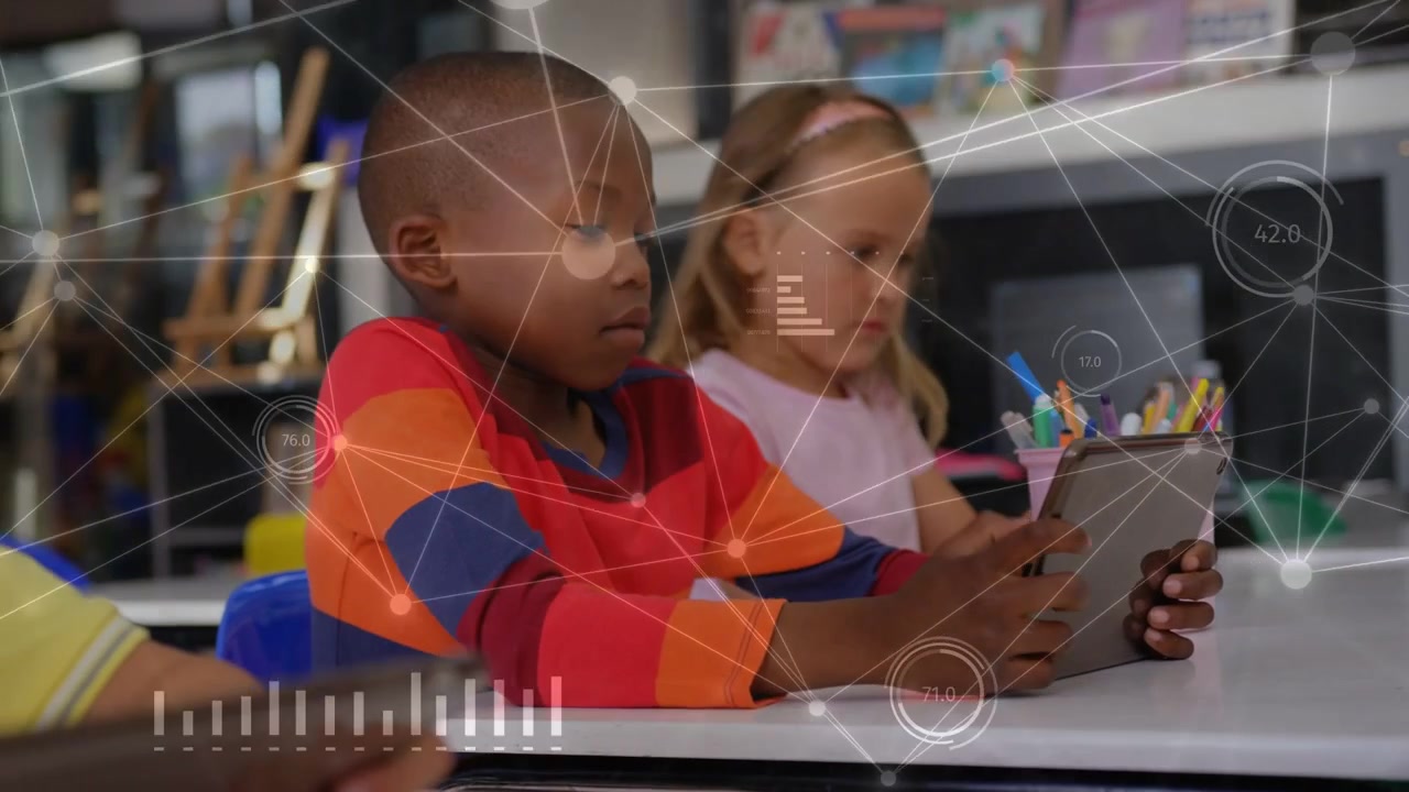 Boy in red sweater tapping tablet and generating animated network data for classroom learning