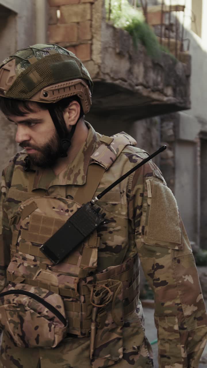 Young Soldier Walks In The Destroyed Streets Of The War Torn Town