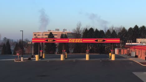 truck diesel gas station in sunset, sunrise, aerial view of truck refueling pump in america, road transportation and fossil fuel consumption concept