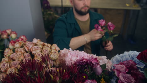 Florist-Collects-Bouquet-and-Looks-at-Camera