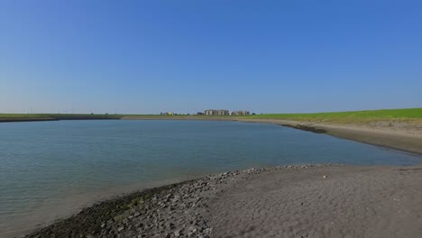 Manmade-bay-harbour-surrounded-by-dykes-in-Kruingen,-the-Netherlands