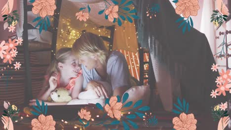 animation of flower icons over happy caucasian mother and daughter in blanket fort