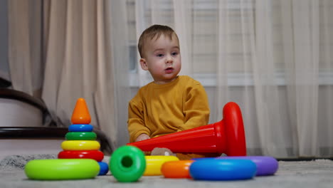 baby playing with stacking rings