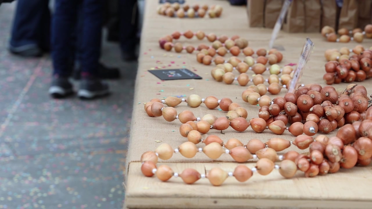 Onions for sale on farmers market, establishing shot
