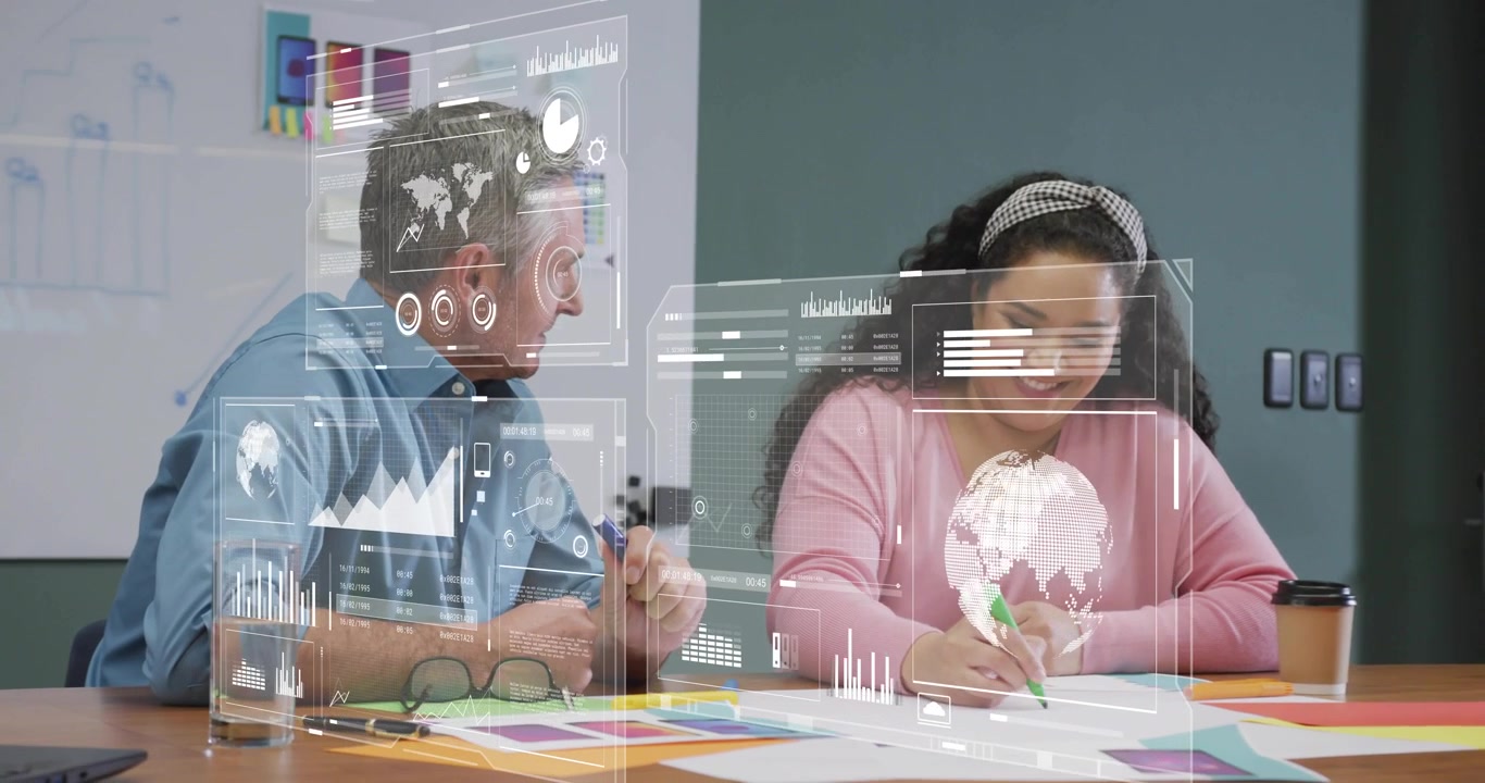 Consultant pointing charts and analyst annotating as hologram charts emerging in business analysis