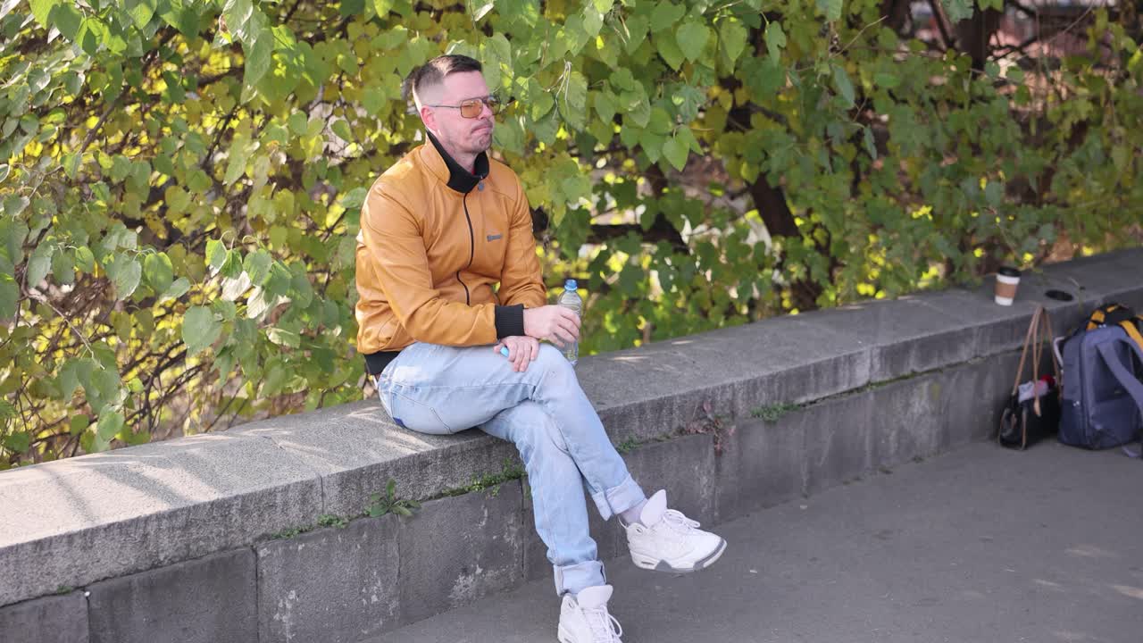 Man sitting on a wall outdoors
