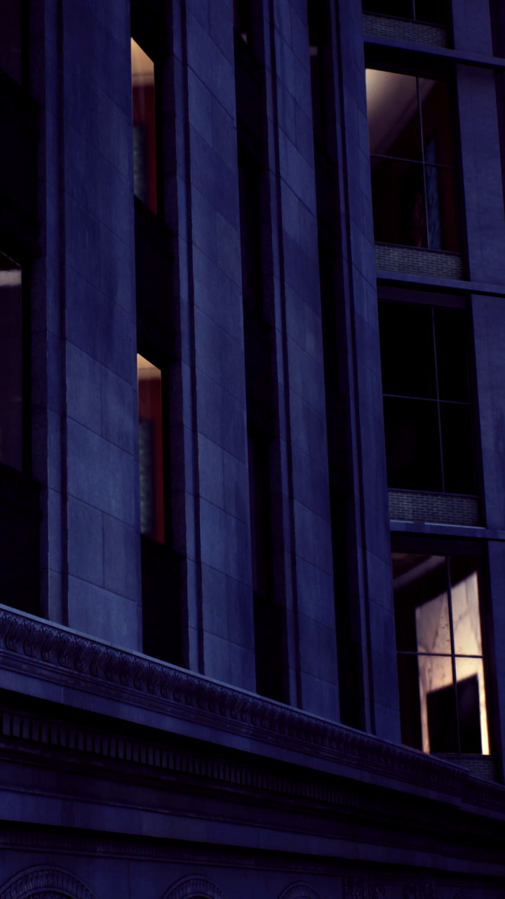 Building exterior at night showing light from window in urban area