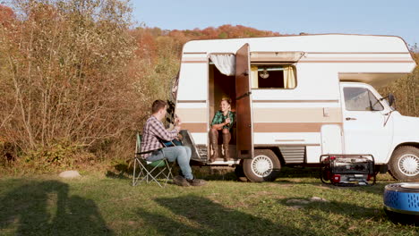 Beautiful-girlfriend-on-the-stairs-of-retro-camper-van