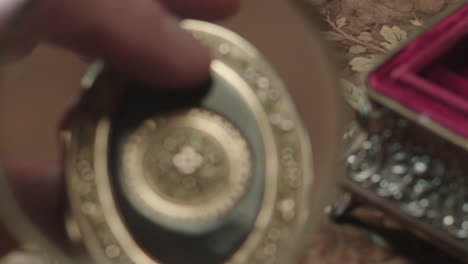 an older man evaluates antique box