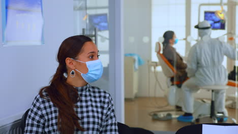 portrait of woman with protection mask discussing