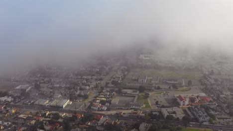 an aerial through the fog reveals a southern california city ventura california