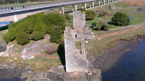 Tower-ii-century-BC-Atlantic-Sea,-Viking-invasion,-historical-artistic-monument,-National-Artistic-Treasure,-sunny,-drone-shot-orbits-to-the-right