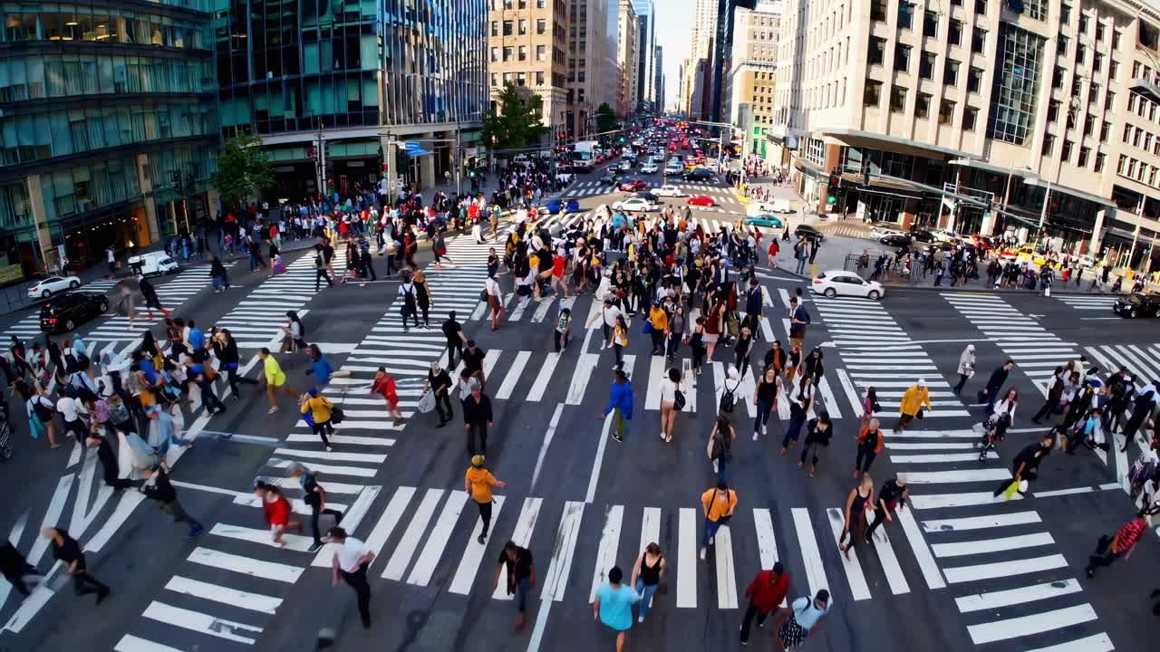 Aerial video view of a bustling city intersection, capturing dynamic movement and urban life