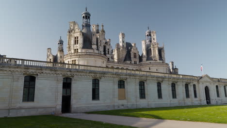 renaissance french castle with ornate towers on sunny day, historic and majestic vibe