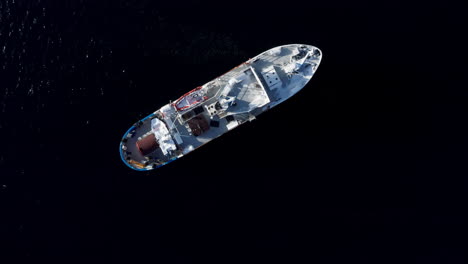 aerial drone view polar fjord cruise ship sailing in the arctic sea in tromso, norway