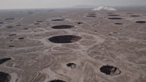 aerial view of craters in desert landscape
