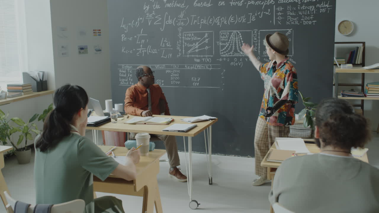 A group of students and a teacher in a science classroom during a lecture or presentation