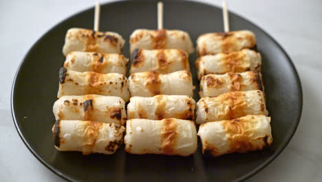 grilled tube shaped fish paste cake or tube squid skewer