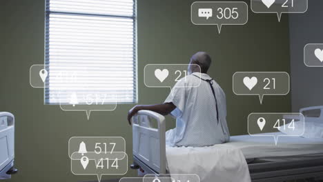animation of media icons over african american male patient on hospital bed