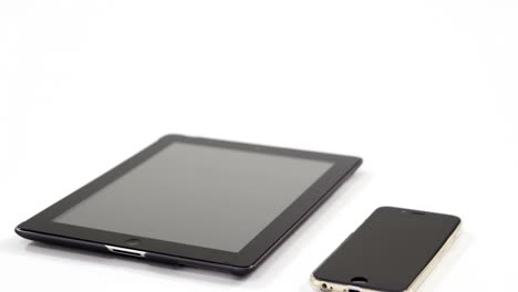 Digital-tablet-and-mobile-phone-against-white-background