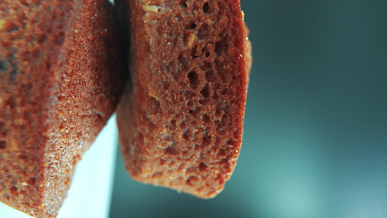 A vertical macro close up shot of tasty cupcakes, on a 360 rotating stand, studio lighting, slow motion, smooth movement, 4K video