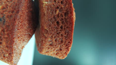 a vertical macro close up shot of tasty cupcakes, on a 360 rotating stand, studio lighting, slow motion, smooth movement, 4k video