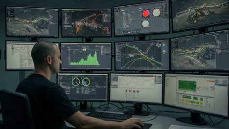 a data analyst monitors critical operations using multiple screens in a high-tech control room, analyzing complex data visualizations for informed decision-making