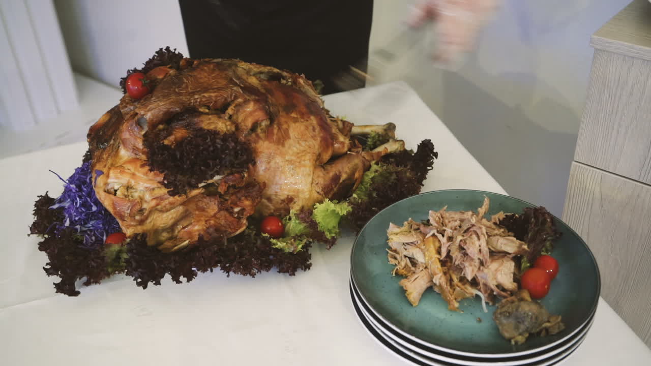 Juicy roast turkey is cut into pieces on Thanksgiving Day. Food. Juicy meat.