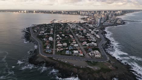 Aerial-drone-of-Punta-del-Este-city-and-coastline,-Uruguay