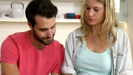 Couple-reading-paper-together