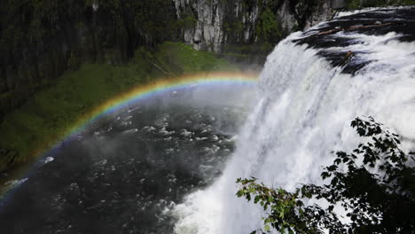 still shot of beautiful rainbow over the upper mesa falls in idaho, usa