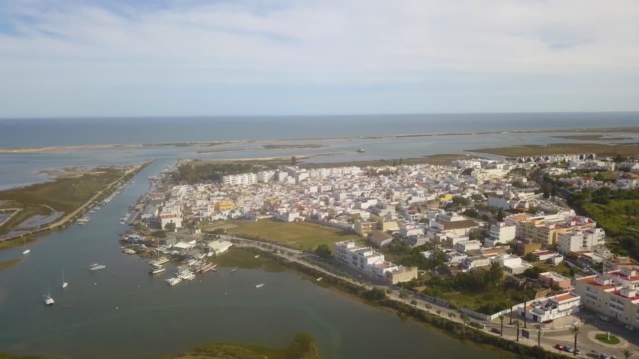 Aerial view over the small harbor and fishing village at Fuseta on the Algarve Portugal