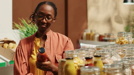 regular client choosing vegan pasta and homemade sauce from supermarket